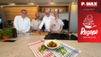 Peter Lehner, Chefkoch Josip, Mario Grüninger und Branimir Tončinić präsentieren in einer modernen P.MAX Küche die dalmatinische Fischsuppe. Im Vordergrund steht eine Schüssel des Gerichts, garniert mit frischen Kräutern, auf der Arbeitsfläche.